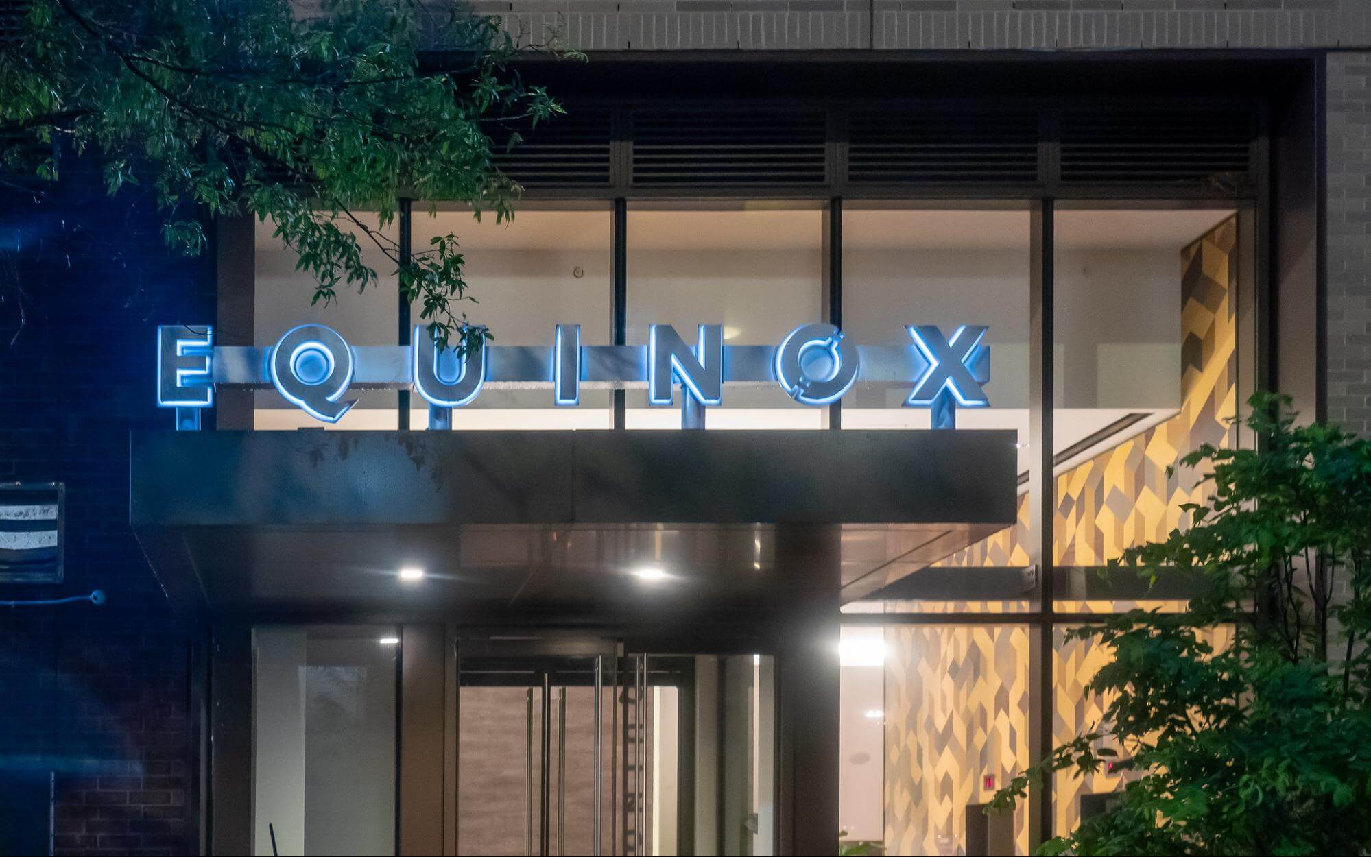 Equinox Gyms brand on a building.