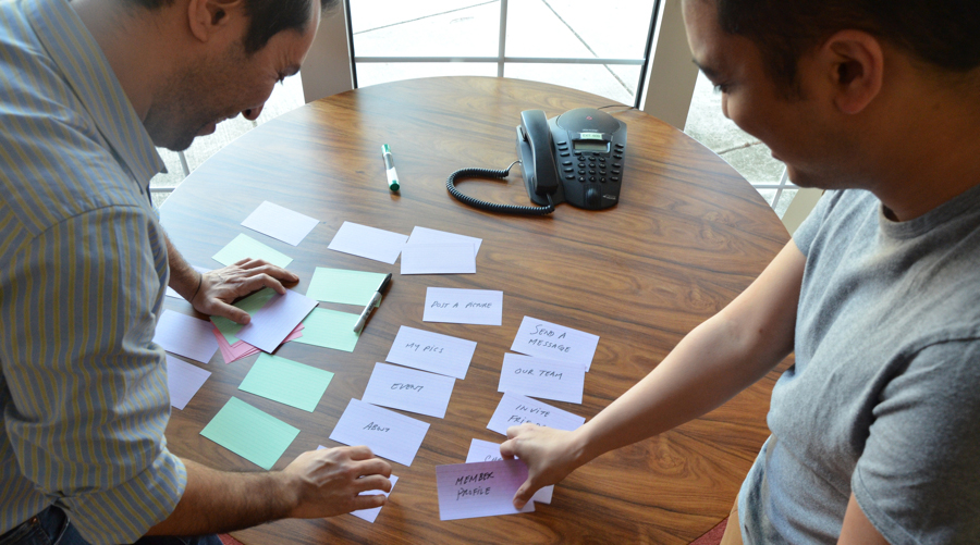 A card sorting session on a table used to demonstrate words and categories.