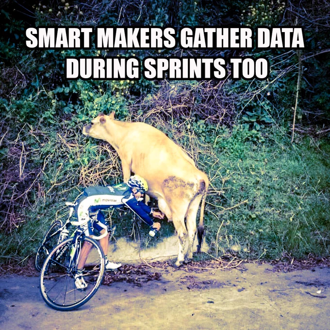 smart makers gather data during sprints too. this image shows a cyclist on the side of the road, filling a container with milk directly from a cow's utters. 